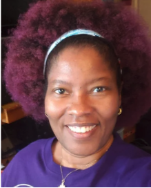 Black female wearing purple shirt